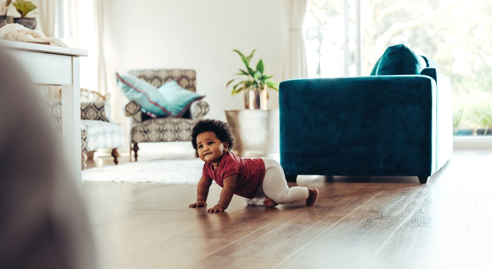 Baby crawling around their new home